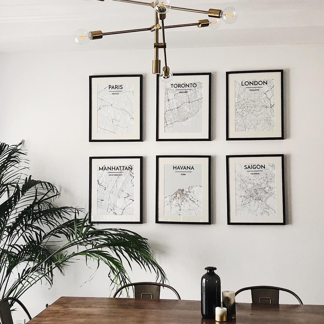 Mix of City Map Prints on Wall